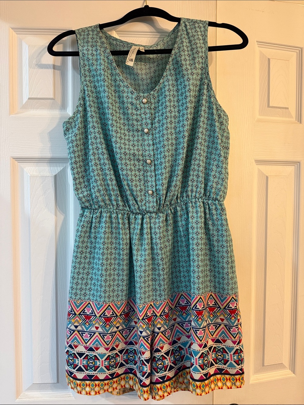 Juniors Aqua Patterned Sleeveless Romper Geometric pattern at bottom . Size Lg